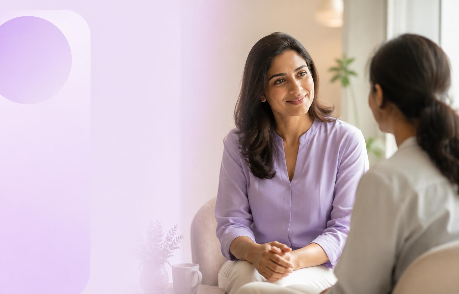 A ResetWell Plus clinician listening attentively to a woman during a consultation